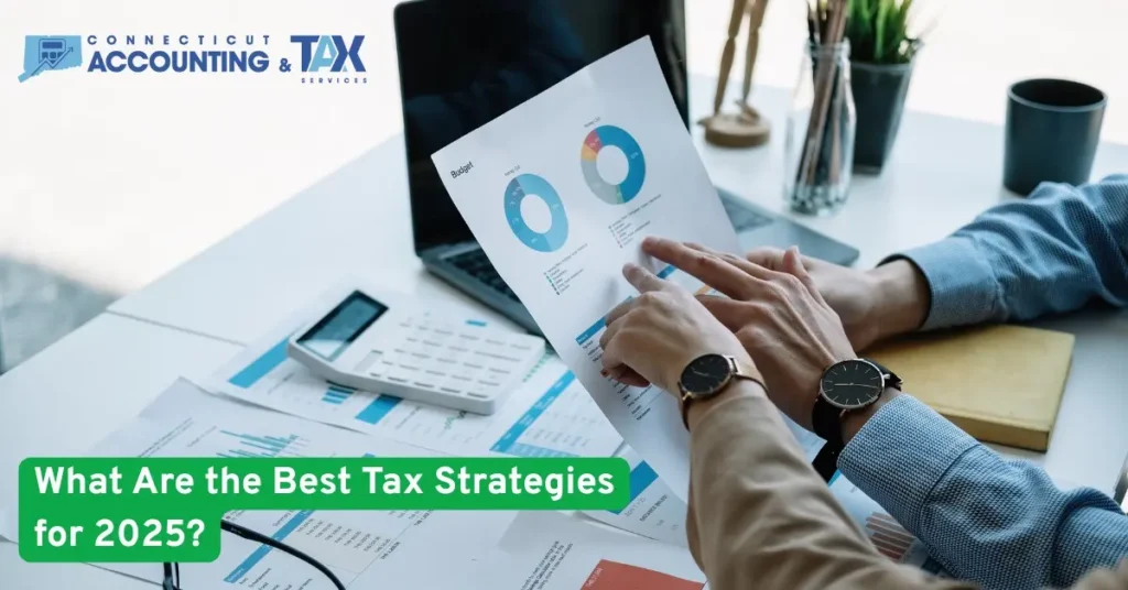 Two professionals reviewing financial charts and graphs with text overlay: Best Tax Strategies for 2025.